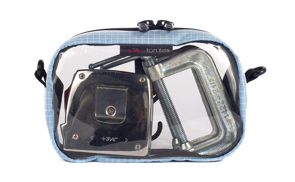 A Acuity (ice blue) with white grid pattern (Halcyon) 3D Clear Organizer Cube filled with sundries.